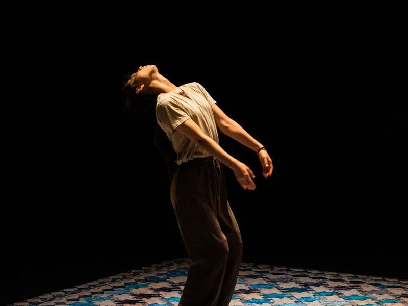 Person in mid-motion showing fluidity and rhythm.