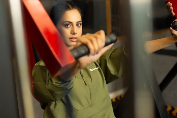 Woman in a focused state during a workout session.